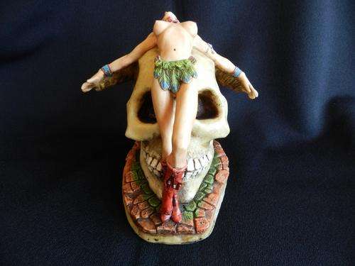 Skull on base with Siouan Indian Princess draped over skull