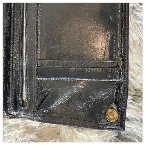A Vintage Leather Wristlet by Woolworths