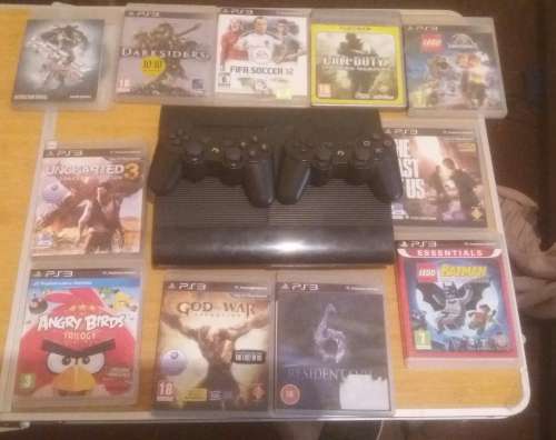 ps3 superslim 500gb with two controllers and 11 games