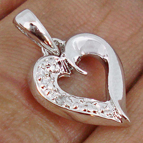 NATURAL WHITE DIAMONDS SET IN A SOLID HEART PENDANT CRAFTED IN .925 STERLING SILVER