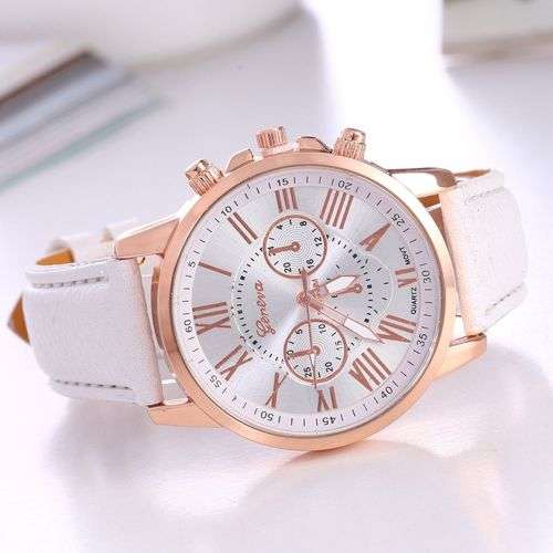 OFF WHITE FACE AND STRAP  GENEVA DIAL GOLD CASE WITH ROMAN NUMERALS  LADIES STUNNING WATCH