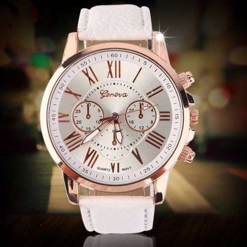 OFF WHITE FACE AND STRAP  GENEVA DIAL GOLD CASE WITH ROMAN NUMERALS  LADIES STUNNING WATCH