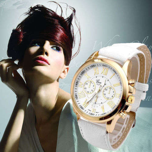 OFF WHITE FACE AND STRAP  GENEVA DIAL GOLD CASE WITH ROMAN NUMERALS  LADIES STUNNING WATCH