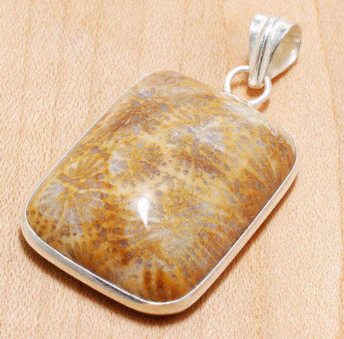 GENUINE FOSSIL CORAL PENDANT CRAFTED IN HALLMARKED .925 STERLING SILVER