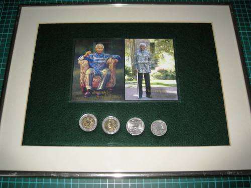 TWO FRAMED MANDELA MEMORABILIA CONTAINING COMMEMORATIVE STAMPS AND COINS