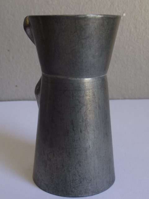 CARROL BOYES MAN DESIGN PEWTER AND ALUMINIUM TOT MEASURE