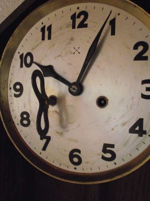 OAK CASED WALL CLOCK IN WORKING CONDITION
