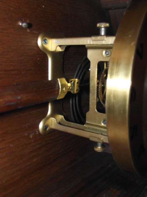 OAK CASED WALL CLOCK IN WORKING CONDITION
