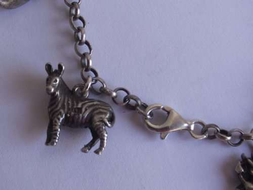 BEAUTIFUL STERLING SILVER CHARM BRACELET WITH 10 ASSORTED CHARMS ATTACHED