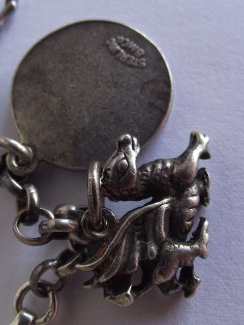 BEAUTIFUL STERLING SILVER CHARM BRACELET WITH 10 ASSORTED CHARMS ATTACHED