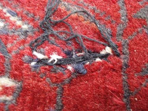 HAND WOVEN PERSIAN RUG --- HAS SOME BALDING AND DAMAGE