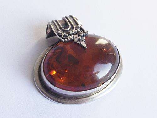 HUGE VINTAGE AMBER AND STERLING SILVER PENDANT