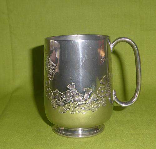 1892 Antique Plated Mug Chased with Flowers, 2 Flags and a Crown (Engraved: F.M.B. 28 FEB 1892)
