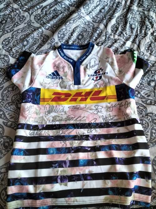 Stomers storm in a teacup jersey signed by team
