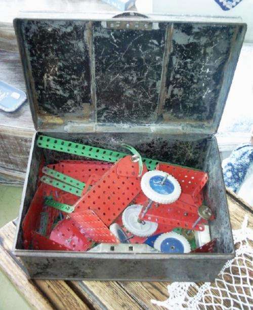 Old Time Cash box containing pieces of Meccano
