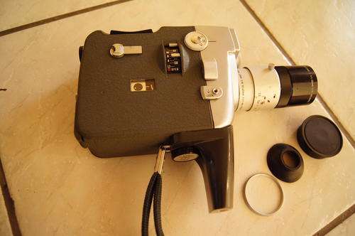 Canon EEE Motor Zoom 8 with original leather case and manual