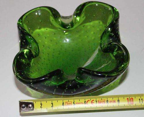 A beautiful green Murano ashtray with controlled bubbles.