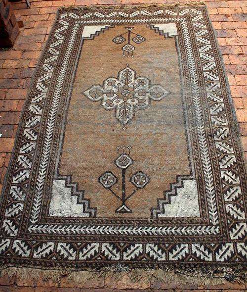 a generously sized hand-knotted tribal Persian carpet 217 x 129cm