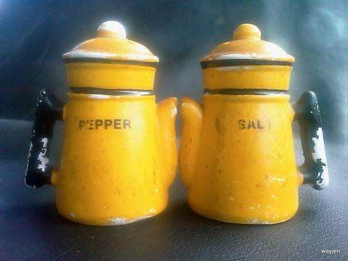 OLD RETRO SALT AND PEPPER POTS. PLEASE NOTE THE PAINT DAMAGE. ONE NEEDS A STOPPER. YELLOW.