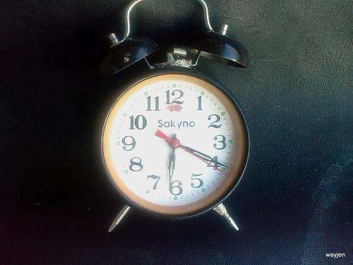 SAKYNO ALARM CLOCK. PARTS ARE BROKEN. WORKING BUT NEEDS REPAIRING. SOMETHING LOOSE INSIDE.