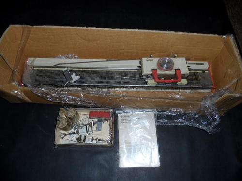 COMPLETE JANOME KNITTING MACHINE. CH-ELEVEN. PLEASE NOTE THE CONDITION. MACHINE HAS SOME RUST.