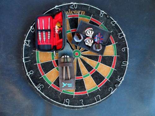DART BOARD AND DARTS.