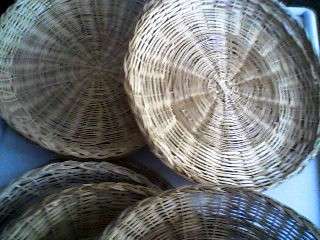 12 X WOVEN PAPER PLATE HOLDERS.
