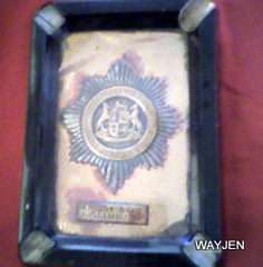 SOUTH AFRICAN POLICE BADGE ASHTRAY.  HAS "AKTIEWE DIENS RHODESIE 1975" WRITTEN ON IT. NEEDS REPAIRS