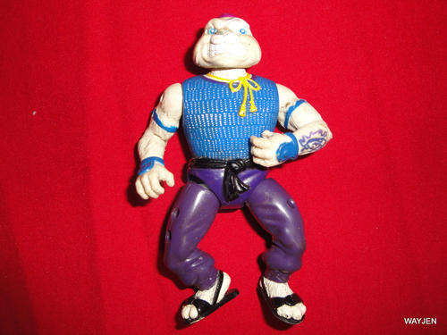 RABBIT LOOKING GUT FROM TMNT. PONYTAIL CUT OFF AND TATTOOS ON ARM.