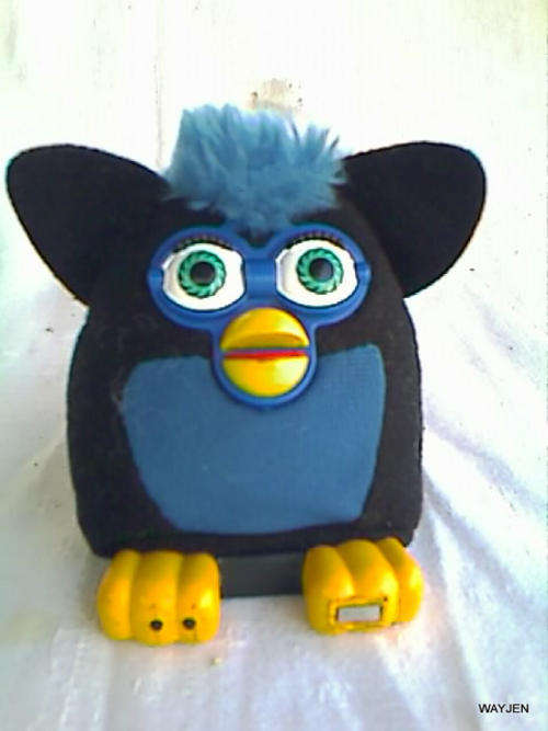 FURBY. McDONALDS TOY. PRESS ON TUMMY AND FURBY TALKS.