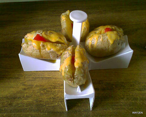 MICROWAVE POTATO BAKE STAND. HOLDS 4 POTATOES AT ONE TIME. QUICK AND EASY TO USE.