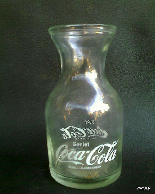 SMALL COCA COLA DECANTER. 2 ALMOST UN-NOTICEABLE CHIPS ON THE LIP.