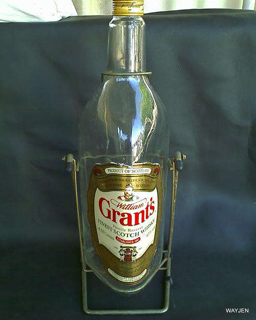 GIANT (53cm) GRANT'S FINEST SCOTCH WHISKEY BOTTLE ON SWING FRAME. PERFECT FOR YOUR BAR.