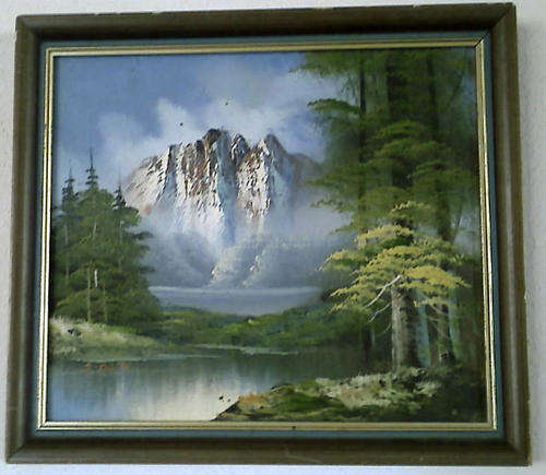 BEAUTIFUL OIL ON CANVAS MOUNTED IN A FRAME. SNOW CAPPED MOUNTAIN SCENE IN A FOREST. 29 X 24,5cm.
