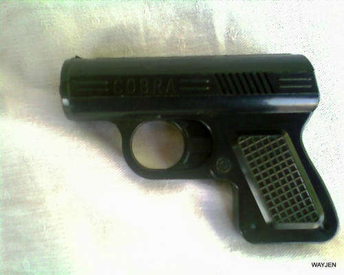 PLASTIC COBRA GAS GUN FOR PERSONAL PROTECTION. NEEDS NEW REFILL CANNISTER.
