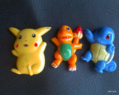 3 LITTLE PLASTIC POKEMON ITEMS. I THINK THEY WENT ON A KIDDIES WATCH ONCE.
