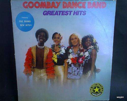 GOOMBAY DANCE BAND. GREATEST HITS ALBUM. FEINT SCRATCHES ON VINYL FROM USE. COVER WORN.