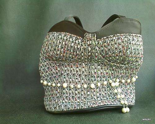 UNIQUE HANDBAG. SHAPED LIKE A BODICE. VERY NEAT.