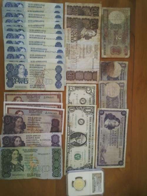 South African notes and Mandela coin....mixed