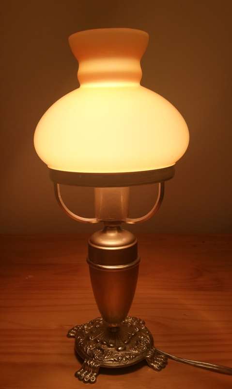 BRASS AND GILT TABLE LAMP WITH STUDENT SHADE