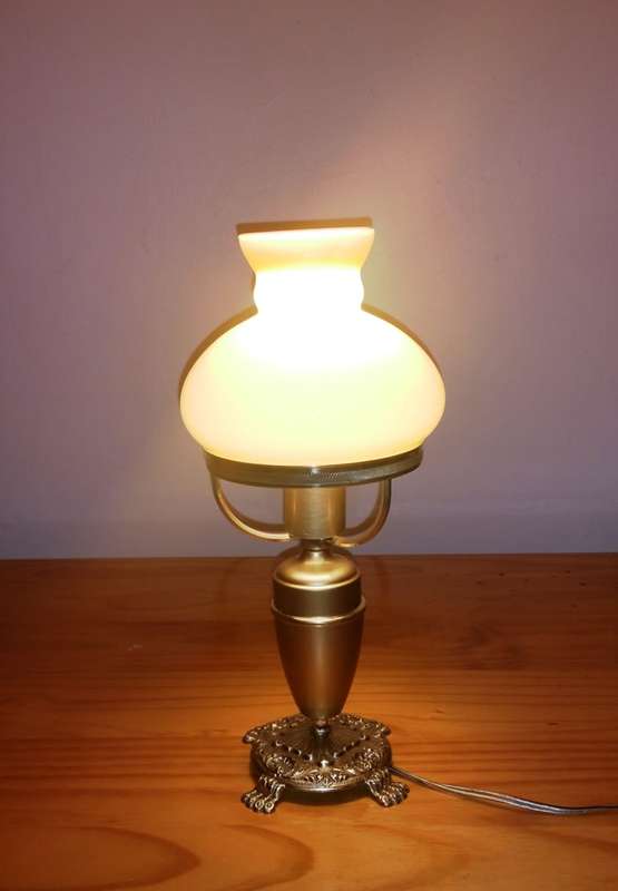 BRASS AND GILT TABLE LAMP WITH STUDENT SHADE