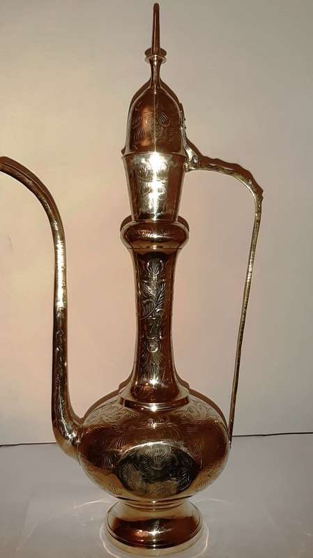 TWO LARGE BRASS DALLAH / SARNA / INDIAN TEAPOTS ON ORNATE BRASS TRAY