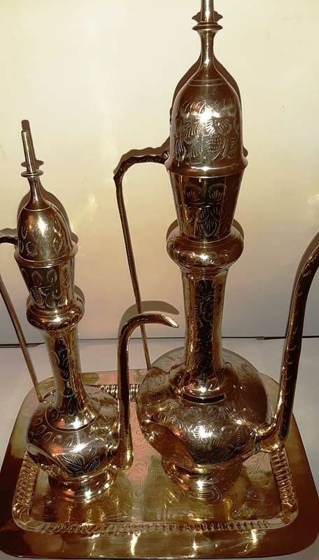 TWO LARGE BRASS DALLAH / SARNA / INDIAN TEAPOTS ON ORNATE BRASS TRAY