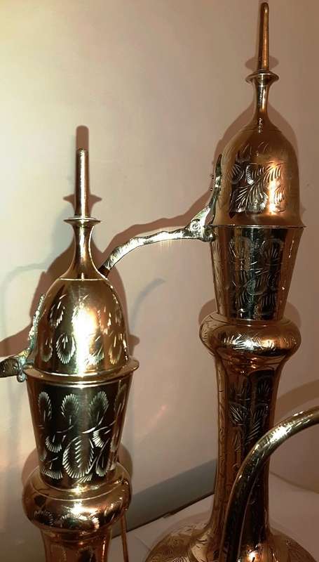 TWO LARGE BRASS DALLAH / SARNA / INDIAN TEAPOTS ON ORNATE BRASS TRAY