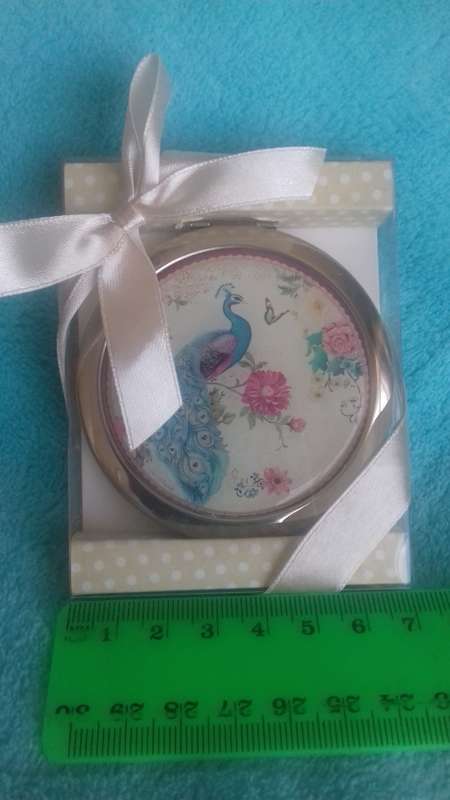 Small handheld mirror