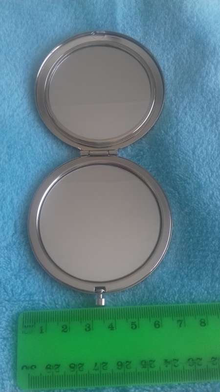 Small handheld mirror