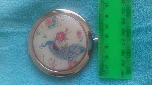 Small handheld mirror