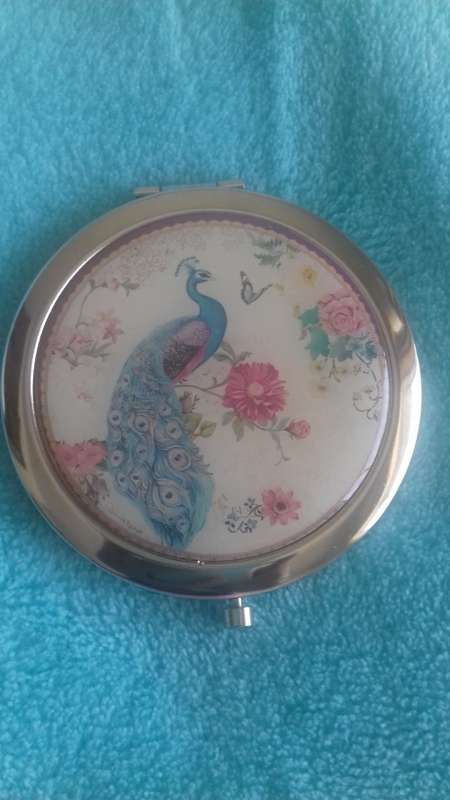 Small handheld mirror