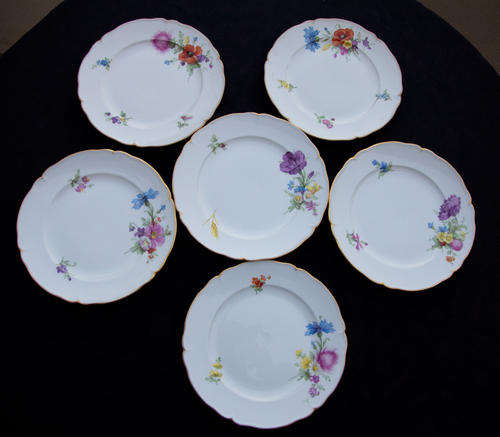 Collection of 6 individual floral-print side plates.
