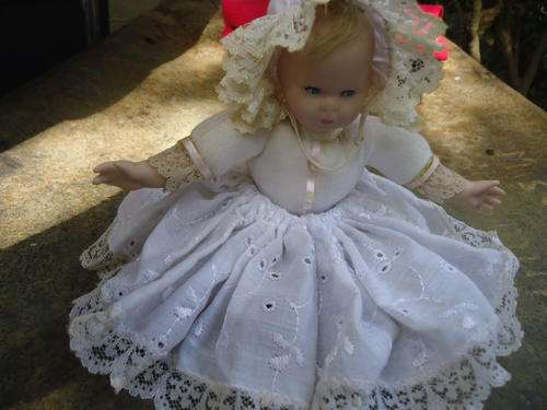 SMALL PRETTY PORCELAIN FACED BABY DOLL IN A WHITE LACED DRESS IN EXCELLENT CONDITION